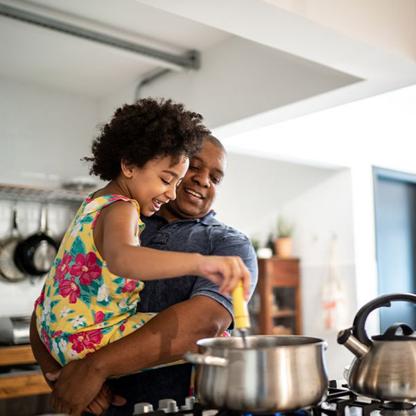 Daughter with father cooking at Atlanta, GA.