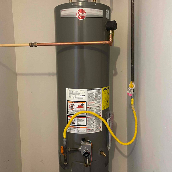 Gas Water Heater Installed in a Room, Accompanied by a Hose, located in Atlanta, GA
