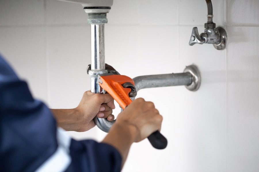 A Technician is Performing Plumbing Repair at Residential House in Smyrna, GA