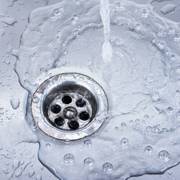 A Sink Draining Water Symbolizing Efficient Sewer Cleaning in Atlanta, GA