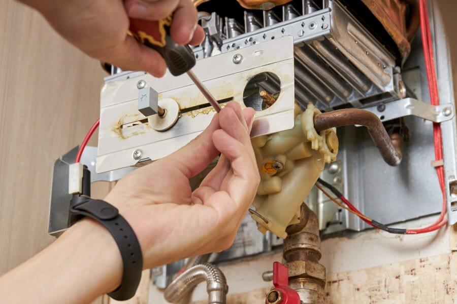 A Technician is Performing Water Heater Repair Service in Atlanta, GA