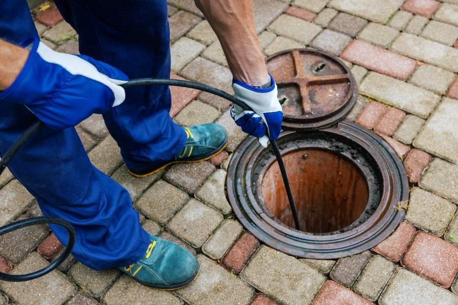 Quick Action Plumbers, dedicated employee giving Emergency Drain Cleaning service in Atlanta, GA