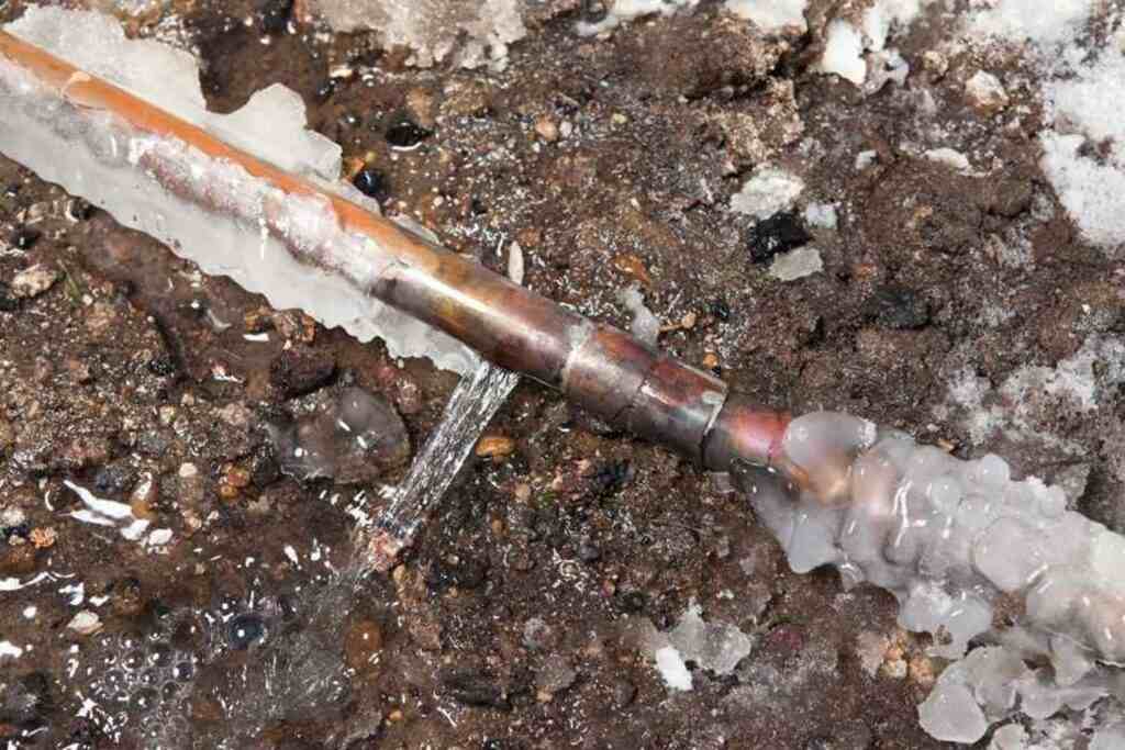 A pipe with ice on it, positioned on the ground in Atlanta, GA