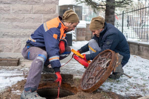 Plumbers checking pipes in the winter