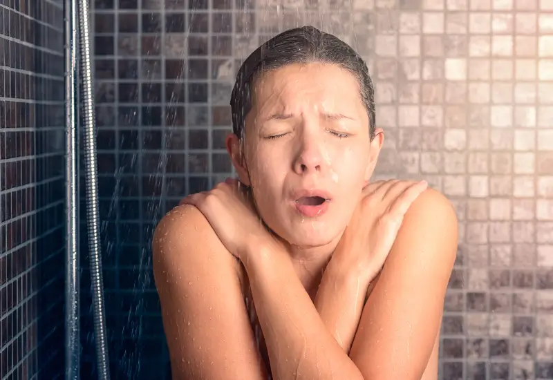 A woman shivers in the shower in Metro Atlanta