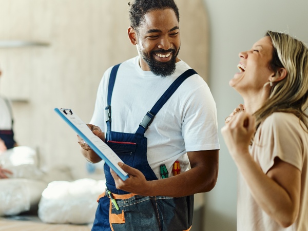 Plumber with happy customer