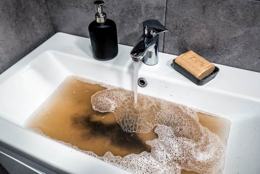 A Clean Sink with Flowing Water Representing Effective Drain Cleaning in Atlanta, GA