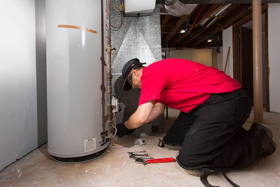 A Technician Performing Water Heater Repair Service in Dallas, GA